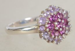 A silver 925 ladies dress ring with pink stones ar