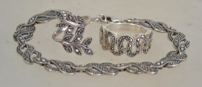 A group of silver and marcasite jewellery to include a marcasite bracelet with infinity link
