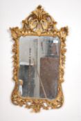 A 20th century rococo gilt framed scroll work mirr