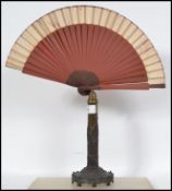 A believed late 18th century telescopic table fan of gilded metal and brass construction. The