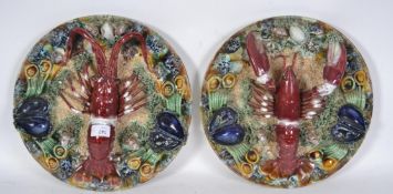 A pair of large ceramic continental glazed majolica lobster plates with heavy glazed embellished