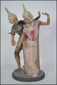 An original large Lladro porcelain figure group entitled ' Thai dancers ', each figure bright colour