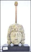 A 20th century marble South American tribal mask table lamp. The mask with frog to head being a sign