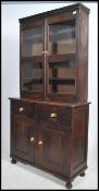 A 20th century oak Edwardian glazed bookcase with cupboard below. Measures 191cm high x 98cm wide
