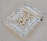 A Victorian mother of pearl card case, the mother of pearl with wriggle-work engraving with a