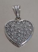 A 9ct white gold and diamond ladies necklace pendant in the form of a heart. Total weight 3.3g