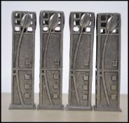 A set of four silver metal / pewter tooth pick holders in the manner of Rennie Macintosh. Stamped to