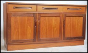 A 1970's retro G-Plan teak wood ' Fresco ' sideboard having inset plinth base with short drawers and