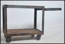 An Industrial metal and panel wood trolley believed to be from a funeral parlour being raised on