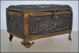 A stunning 19th brass ladies miniature jewellery casket box being case in repousse with scenes of