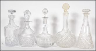 A collection of 19th and 20th century cut glass decanters with stoppers, various designs and styles.