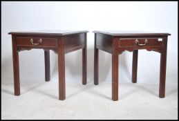 A pair of matching mid 20th century mahogany Georgian style bedside tables of square form having