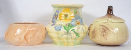 A 1930's Art Deco Crown Ducal dripglaze vase of ribbed design with floral spray being stamped to the