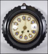 A lated 19th century French Comptoise bulls eye wall clock with ebonised and gilt dial inlaid with