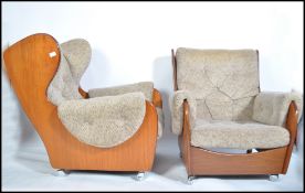 A Kofod Larsen for G-Plan vintage pair of 20th century retro teak framed  ' saddle ' armchairs