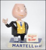 A vintage mid 20th century bar / counter top advertising match strike for Martell Brandy stamped