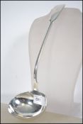 A very large William 4th Regency silver hallmarked ladel believed to be by William Traies having