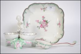A stunning KPM porcelain cherub / putti adorned table salt centrepiece and salt / conserve dishes