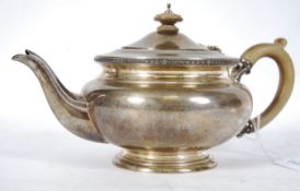 A silver hallmarked teapot with shaped handle by Blackmoor and Flether having London hallmarks for