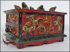An unusual asiatic - thai handpainted spice box in red and green painted finish with section top