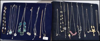 A collection of 20 silver and costume jewellery necklaces to include floral drop pendants, heart