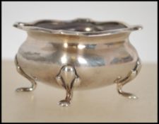 A silver hallmarked table salt on cabriole legs possibly by William Batt bearing Chester hallmarks