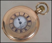 An early 20th century half hunter pocket watch with crown wind action by Record. The dial marked