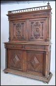 A 19th century French buffet sideboard cabinet having shaped plinth base with profusely carved