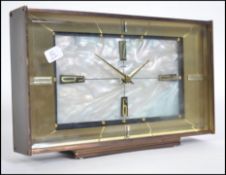 A vintage 20th century Metamec mother of pearl automatic clock of rectagonal form having mother of