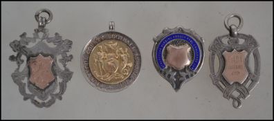 A collection of silver and gold football fob medals to include Chester hallmarked 1918-1919 League