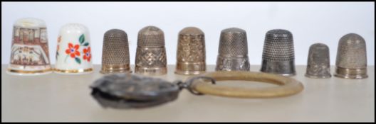 A Victorian silver babies rattle with loop handle, the rattle wtih babies face. Together with a