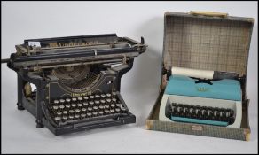 An early 20th century American made Underwood typewriter together with a cased retro typewriter.