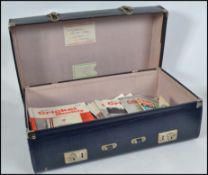 A collection of vintage 20th century Cricket Monthly magazines set within a blue faux crocodile skin