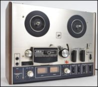 An original vintage Akai 4000DS model reel to reel tape recorder player set within original wooden