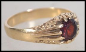A 9ct gold and ruby garnet stone ring being hallma