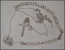 A ladies silver twin chain linked bracelet with hallmarked padlock locket, weight 6.8g - size 11cms.