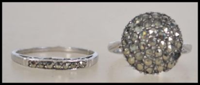 Two silver and marcasite ladies dress rings, one being hallmarked silver the other marked silver.