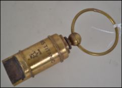 A brass cased white Star line whistle with notation for S.Auld Glasgow having large bale to one end.