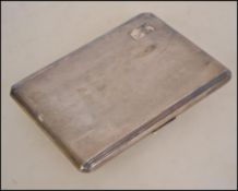 A silver hallmarked engine turned cigarette case bearing Birmingham assay mark, makers mark for E