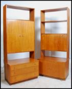 A pair of retro mid century Beithcraft of Scotland teak wall cabinets. The bases with breakfronts