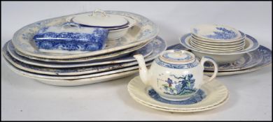 A collection of blue and white ceramics dating from the 19th century to include willow pattern