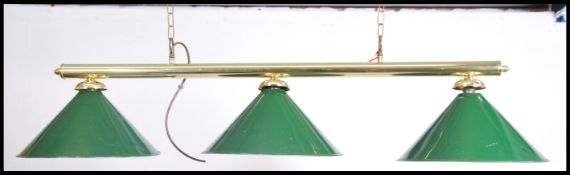 A modern brass ceiling mounted, hanging snooker table down light. Three lights and 3 baize green