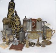 A collection of pewter tankards and horse brasses. To include examples with Nelson / hms victorycetc