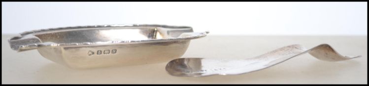 A silver hallmarked shoe horn by HM&Co, Birmingham 1938 being inscribed Wyley 1938. Total weight 27g