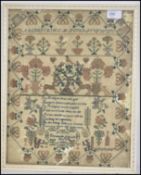 A 19th century Victorian needlepoint sampler decorated with sailing boats, trees, flowers and