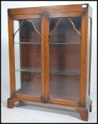 An Edwardian oak china display cabinet having full