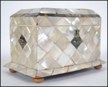 A mid Victorian mother of pearl and abalone shell tea caddy of rectangular form, the lid