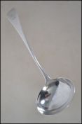 A silver hallmarked George 3rd table ladel by believed Solomon Houghham bearing London hallmarks