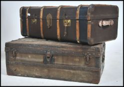 2 vintage steamer trunks from the early 20th century to include wooden bound canvas steamer trunk