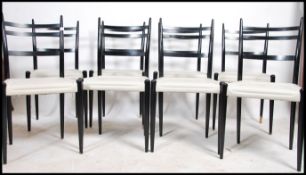 A set of 8 mid century G-Plan dining chairs in the manner of Gio Ponti. The chairs having ebonised